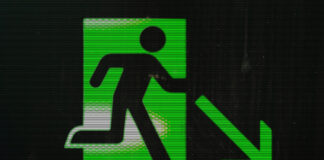 Exit sign of a man who really wants to get out of here